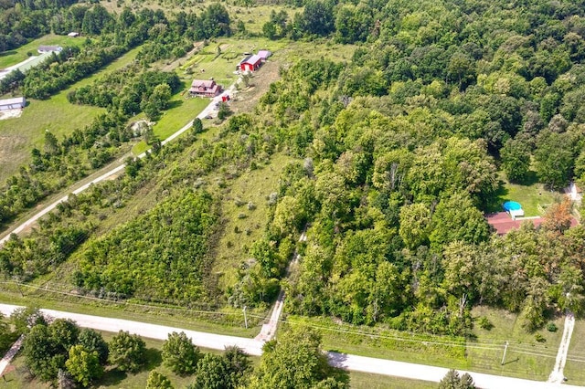 bird's eye view featuring a wooded view