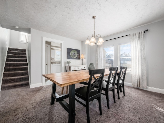 dining area featuring stairs, baseboards, dark colored carpet, and a textured ceiling