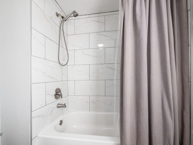 bathroom featuring shower / bath combo with shower curtain