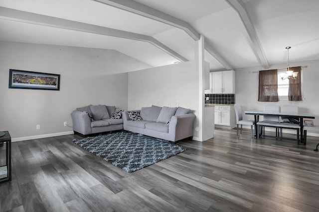 living area with a chandelier, dark wood-type flooring, baseboards, and vaulted ceiling with beams