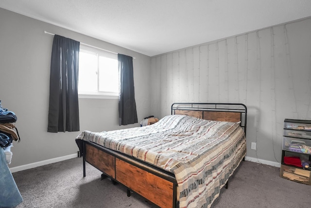 bedroom featuring baseboards and carpet flooring