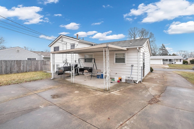 back of property with fence