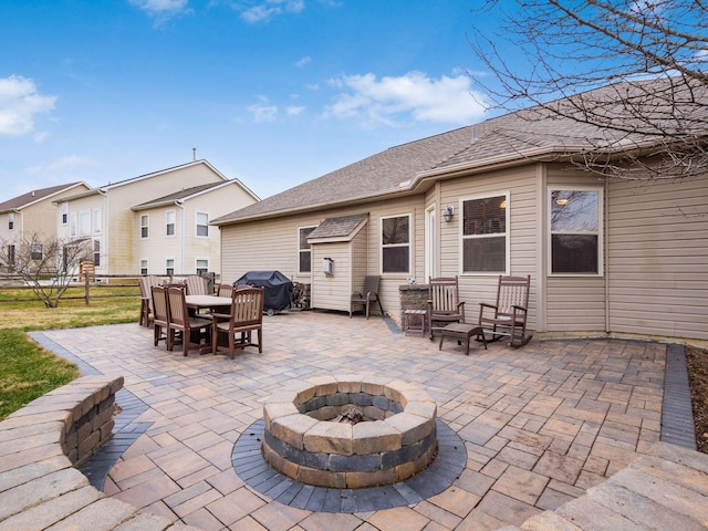 view of patio / terrace featuring outdoor dining space, an outdoor fire pit, area for grilling, and fence