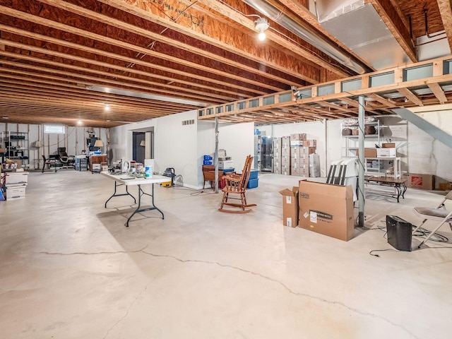 unfinished basement featuring visible vents