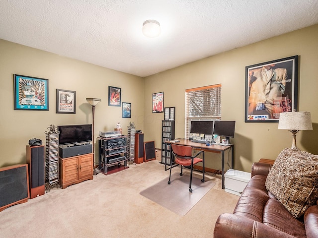 home office featuring carpet and a textured ceiling