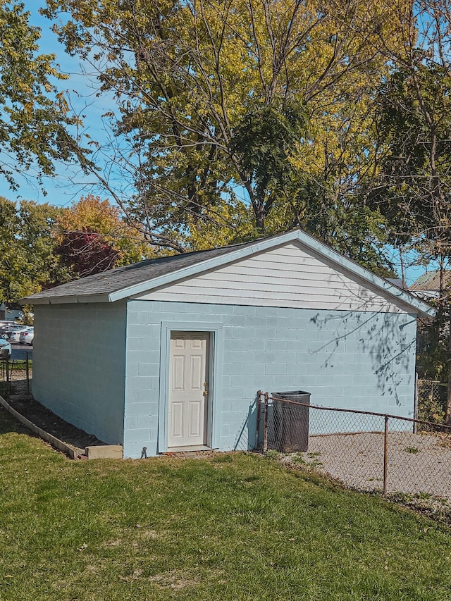 view of outbuilding with central AC unit and fence