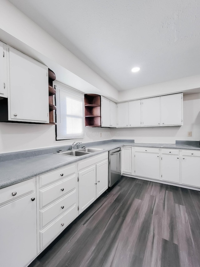 kitchen with dark wood-style flooring, open shelves, white cabinets, a sink, and dishwasher