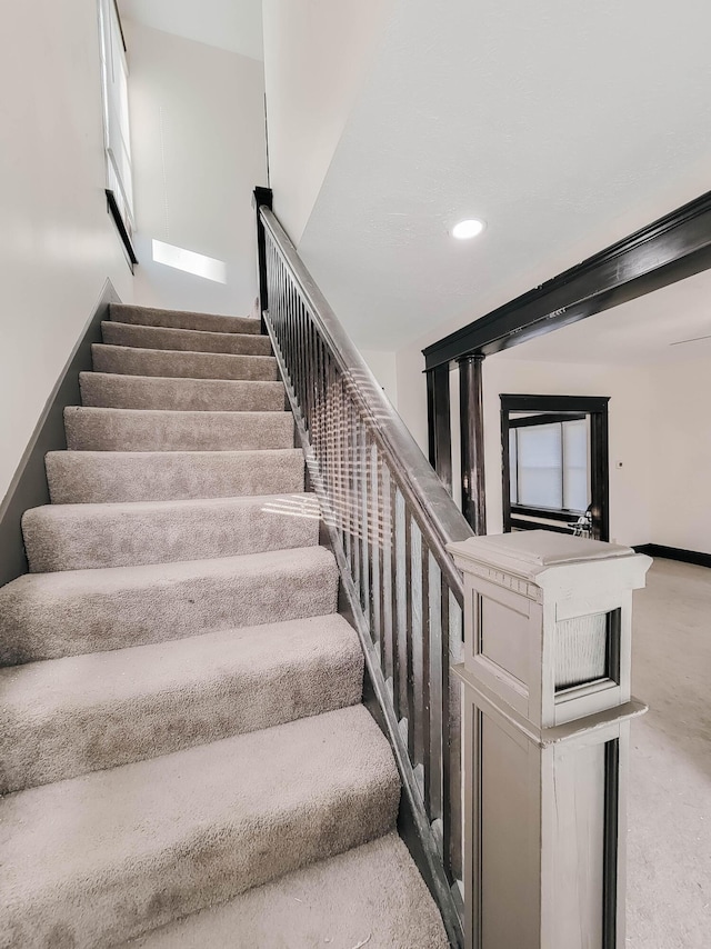 staircase with recessed lighting