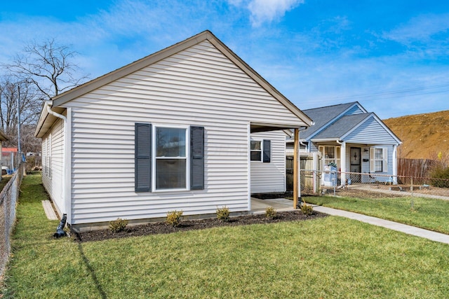 bungalow with fence and a front yard