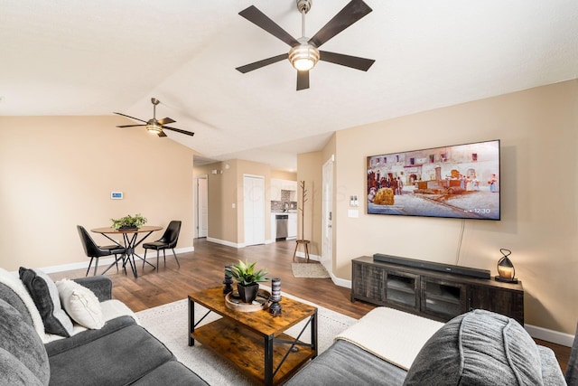 living room with lofted ceiling, a ceiling fan, baseboards, and wood finished floors