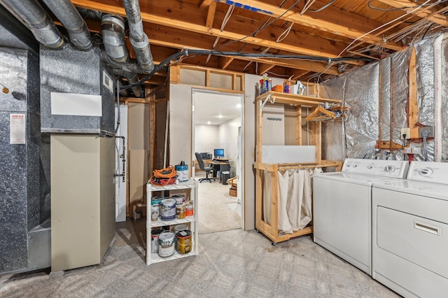 unfinished below grade area featuring independent washer and dryer and heating unit