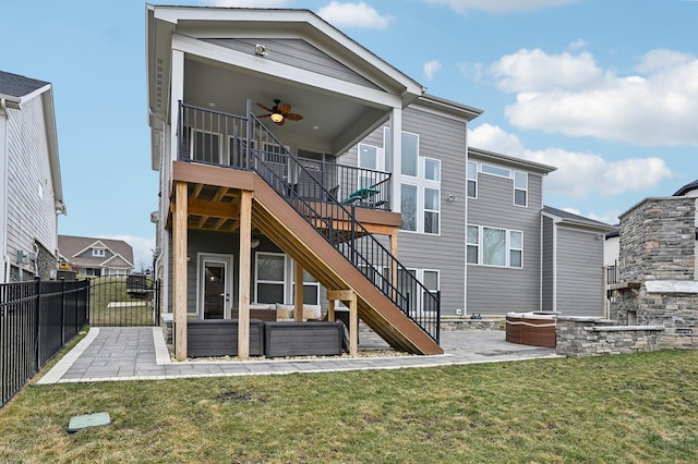 back of house featuring ceiling fan, a patio, fence, stairs, and a yard