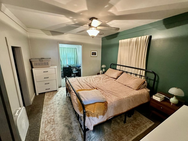 bedroom featuring a ceiling fan and carpet