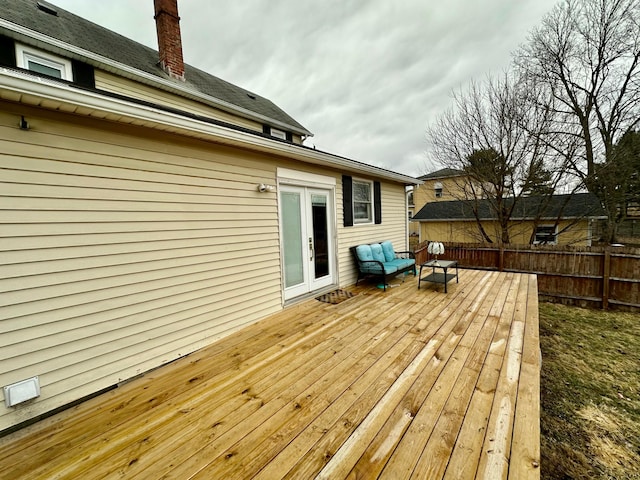 wooden deck featuring french doors and fence