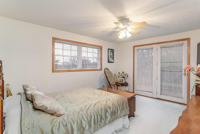 carpeted bedroom with access to outside and ceiling fan