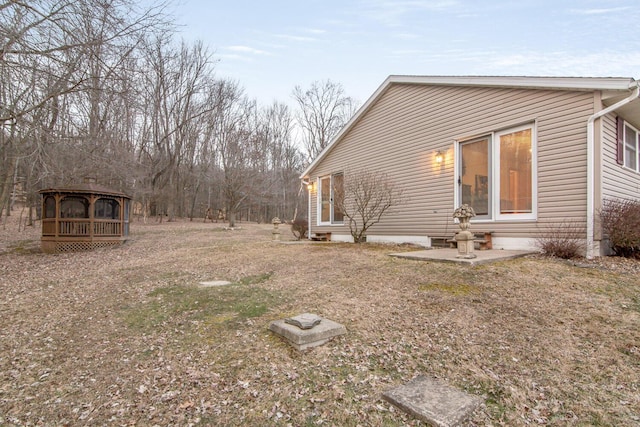 view of property exterior featuring a patio