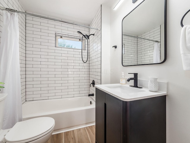 bathroom with vanity, shower / tub combo, wood finished floors, and toilet