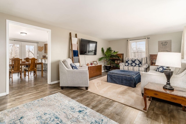 living room with wood finished floors and baseboards