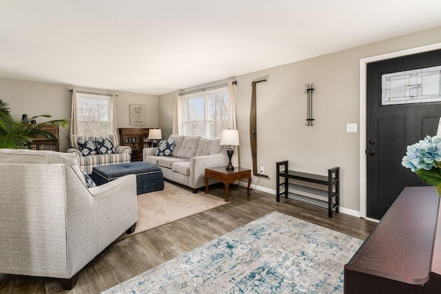 living room featuring baseboards and wood finished floors