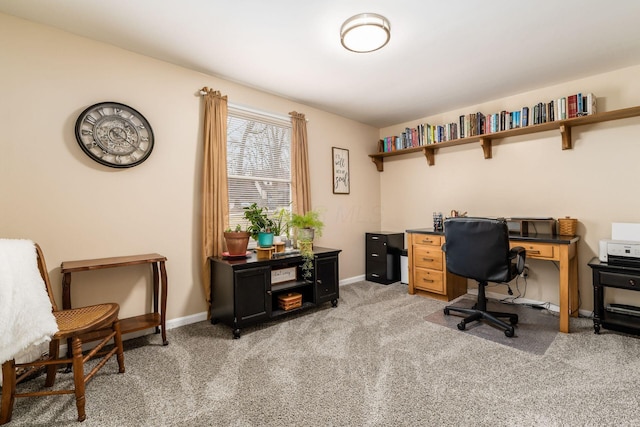 home office featuring light carpet and baseboards