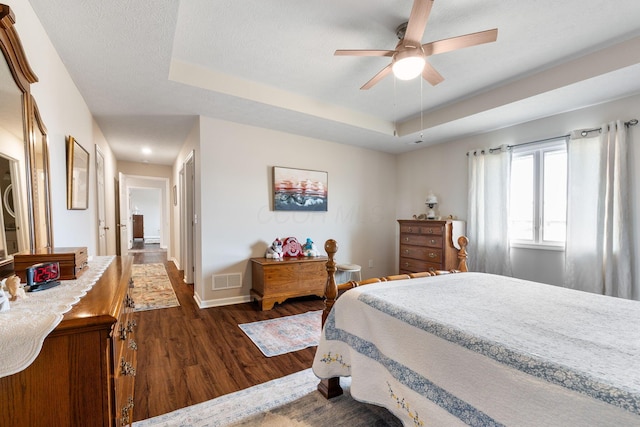 820 Timbers Edge, Marysville, OH 43040 - bedroom featuring dark wood-style flooring, a raised ceiling, visible vents, and baseboards