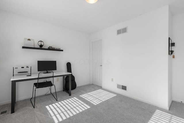 office with light carpet, baseboards, and visible vents