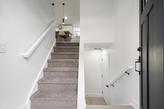 stairway featuring baseboards