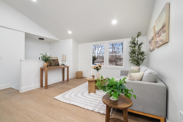 sitting room with recessed lighting, baseboards, vaulted ceiling, and light wood finished floors