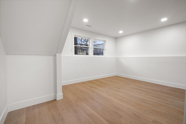 bonus room featuring visible vents, recessed lighting, light wood-style flooring, and baseboards