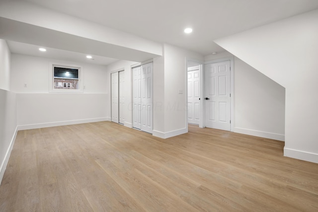 additional living space featuring light wood-style floors, baseboards, and recessed lighting