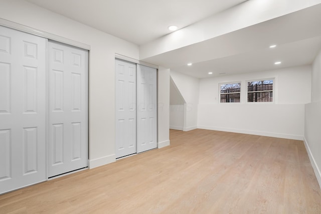 below grade area featuring baseboards, recessed lighting, and light wood-style floors