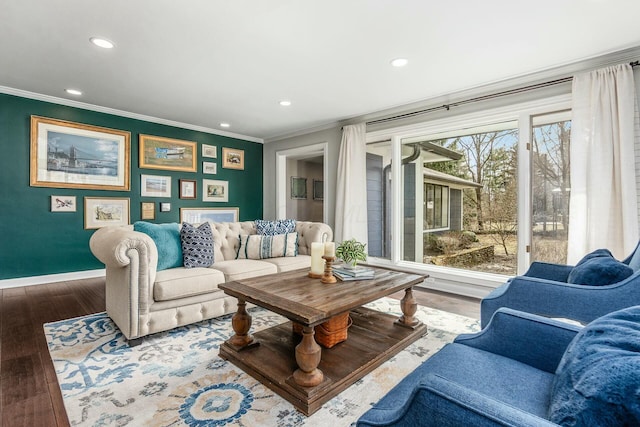 living room with recessed lighting, wood finished floors, baseboards, and ornamental molding