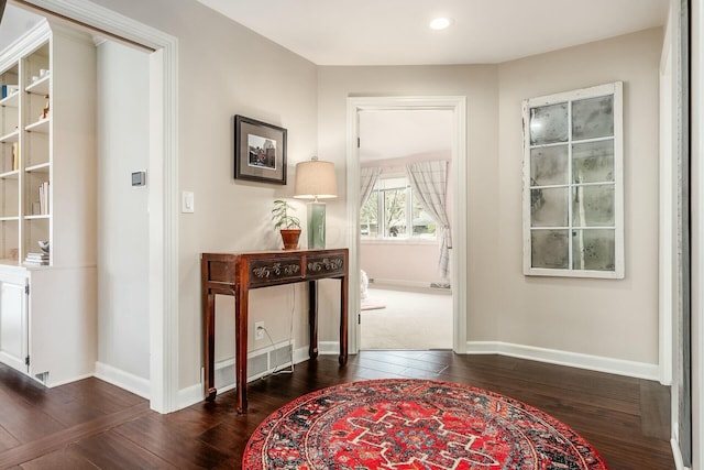 interior space with recessed lighting, baseboards, and dark wood-style flooring