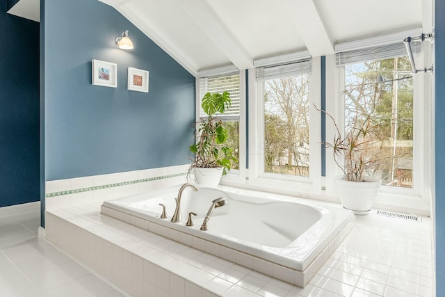 bathroom with a wealth of natural light, visible vents, a bath, and vaulted ceiling with beams