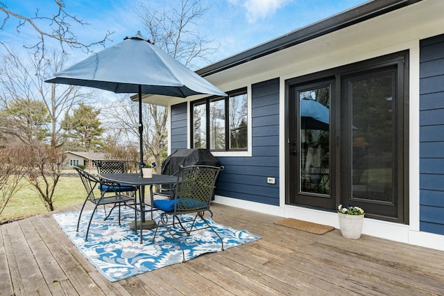 deck featuring outdoor dining area