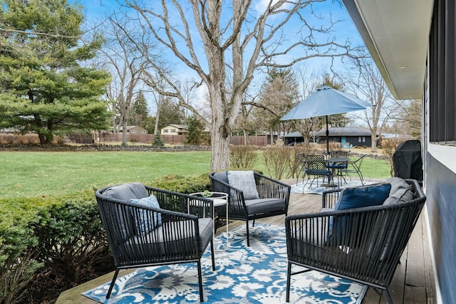 view of patio featuring outdoor lounge area and fence