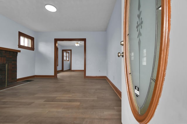 interior space featuring wood finished floors, visible vents, and baseboards