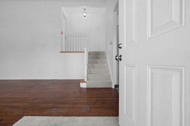 staircase with wood finished floors