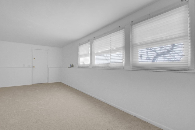 spare room with light carpet
