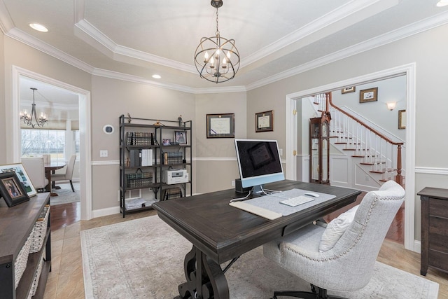 home office with a chandelier, a tray ceiling, and crown molding