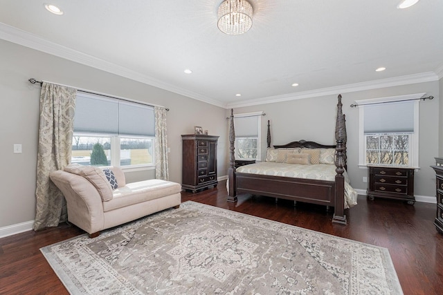 bedroom with ornamental molding, wood finished floors, and baseboards