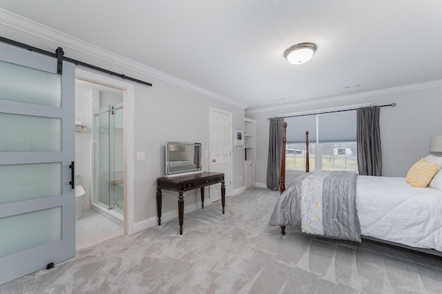 carpeted bedroom featuring baseboards, a barn door, ornamental molding, and a textured ceiling