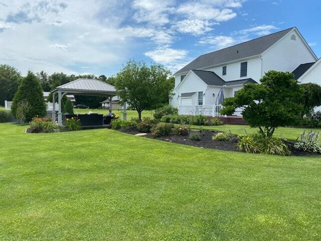 view of yard featuring a carport and a gazebo