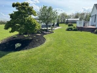 view of yard with a wooden deck