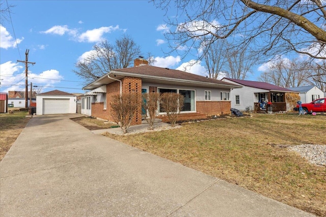 single story home with an outbuilding, brick siding, a chimney, and a front lawn