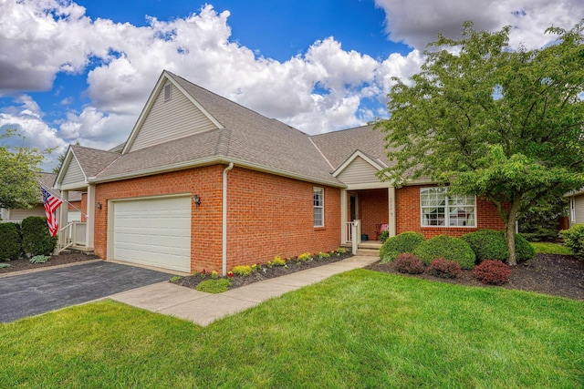6922 Greensview Village Dr, Canal Winchester, OH 43110 - view of front of property featuring brick siding, a garage, driveway, a front lawn, and roof with shingles