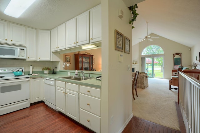 6922 Greensview Village Dr, Canal Winchester, OH 43110 - kitchen with white appliances, a sink, open floor plan, dark wood-style flooring, and white cabinets