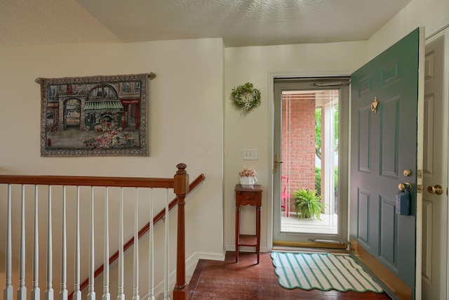 6922 Greensview Village Dr, Canal Winchester, OH 43110 - foyer entrance featuring dark wood-type flooring, baseboards, and a textured ceiling