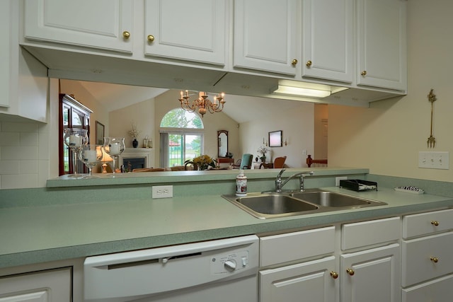 6922 Greensview Village Dr, Canal Winchester, OH 43110 - kitchen with dishwasher, a sink, white cabinets, and lofted ceiling