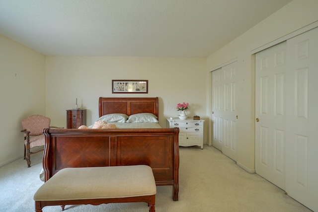 6922 Greensview Village Dr, Canal Winchester, OH 43110 - bedroom with light colored carpet, two closets, and baseboards